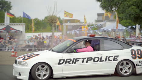 Professional-Stunt-Driver-Drives-And-Drift-An-Action-Car-At-The-Arena-During-Car-Stunt-Show