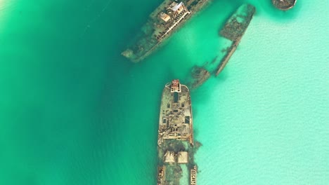 Top-down-fly-over,-beautiful-clear-water,-Moreton-Island-Shipwrecks,-Artificial-reef,-Done-video