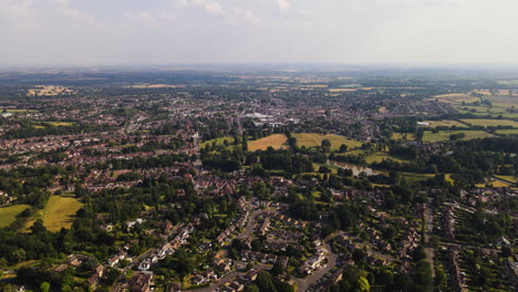 Ariel-landscape-of-English-town-with-houses,-green-countryside