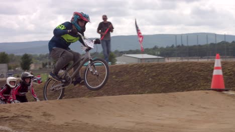Cyclists-Wearing-Helmets-And-Racing-To-Win-During-BMX-Race-Event