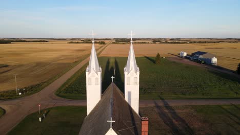 Aerial-footage-of-St-Peters-roman-catholic-church-in-north-American-prairie-during-sunset