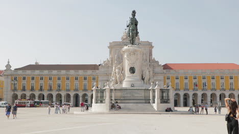 People-Visit-King-Jose-I-Monument-At-Terreiro-do-Paco-With-Ministry-of-Justice-And-Supreme-Court-of-Justice-Building-In-Background-In-Lisbon,-Portugal