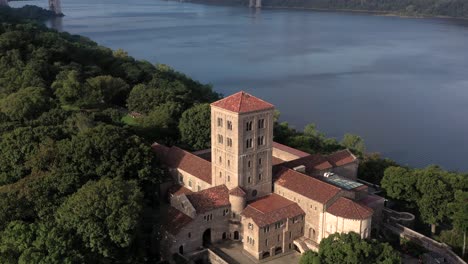 Settling-aerial-clip-of-The-Cloisters-museum-on-the-bank-of-the-Hudson-River-in-NYC-in-crispy-sunrise-light