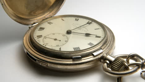 Antique-pocket-watch-ticking-packshot-slow-pan