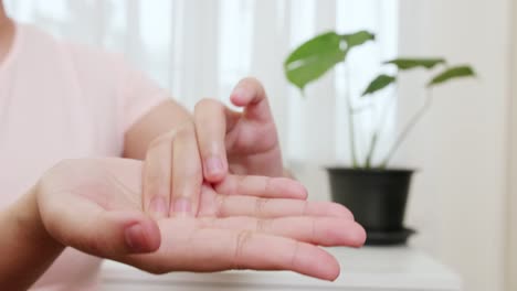 Close-up-of-women-palm-acupressure-self-massage-by-her-hand