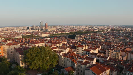 Descending-drone-shot-of-Lyon-France-glowing-in-the-sunset-light