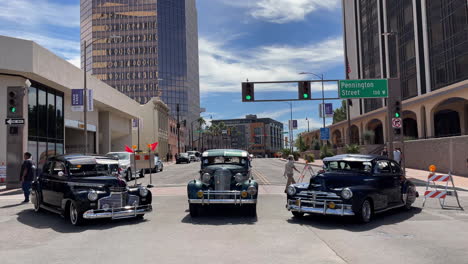 Three-Lowrider-Bomb-Vintage-Cars-Display-At-Tucson-Meet-Yourself-Festival-With-One-Church-South-Building-In-Background
