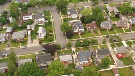 An-aerial-view-over-a-suburban-neighborhood-on-a-cloudy-day