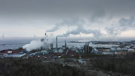 EPIC-AERIAL-establishing-apocalyptic-shot-of-a-smoky-industrial-factory
