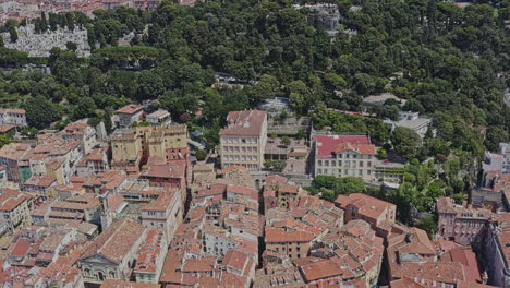 Nice-France-Aerial-v15-birds-eye-view-drone-flyover-castle-hill-waterfall-from-old-city-neighborhood-toward-quartier-du-port-at-daytime---July-2021