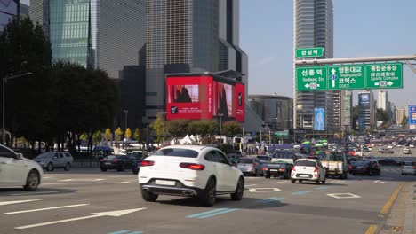 Cars-stopping-on-red-Traffic-light-at-Samseong-station-crossroad-Yeongdong-daero-road-near-Coex-World-Trade-Center-Seoul-South-Korea
