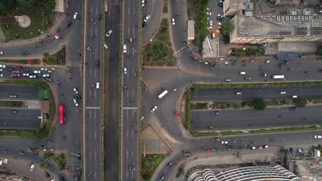 Aerial-Shot-Of-Busy-Traffic-Driving-On-The-Kalma-Chowk-Underpass,-Pakistan