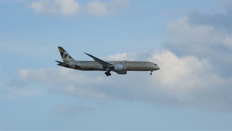 Tracking-shot-of-Etihad-airways-passenger-plane-passing-through-clouds-during-descent-towards-airport