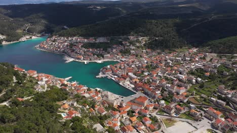 Aerial-View-On-Pucisca-Town-Located-On-The-North-Coast-Of-Brac-Island-In-Croatia---drone-shot