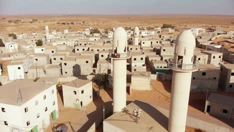 aerial-shot-revealing-two-mosques-at-palestine-near-gaza-in-the-desert-at-an-empty-city