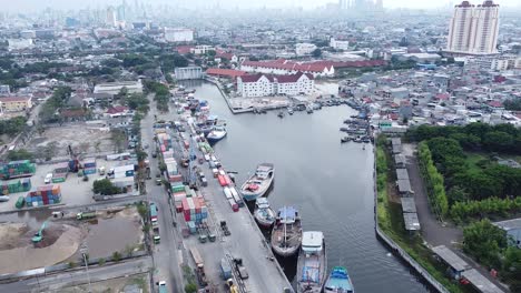 aerial-shot-of-harbor-pier-in-the-middle-of-a-densely-populated-city