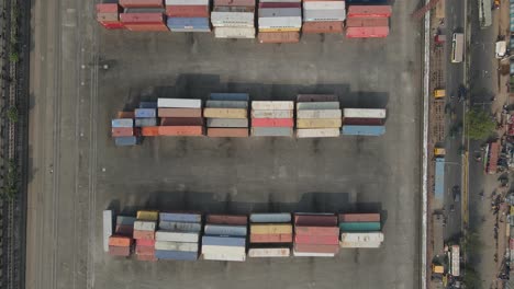 Aerial-top-down-inland-shipping-container-depot-beside-highway