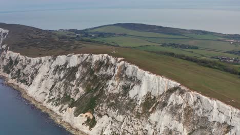 Aerial-Drone-orbit-over-sea-cliffs-at-Tennyson-Monument-Isle-of-Wight