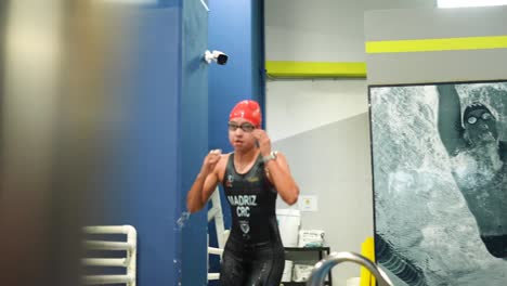 swimmer-exiting-the-pool-in-competition-in-a-triathlon-and-swimming-competition
