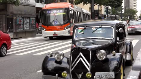 Citroen-Traction-Avant-Executive-Car-On-The-City-Street-In-Sao-Paulo,-Brazil,-Followed-By-A-1956-Chevrolet-Bel-Air-Sport-Coupe