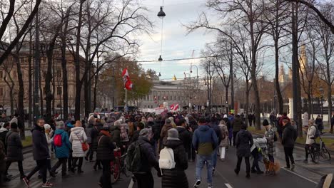 People-flowing-out-onto-streets-to-protest-anti-corona-measures-in-Vienna,-Austria