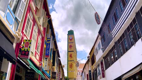 POV-Of-A-Person-Walking-In-The-Street-Along-Shophouse-With-People's-Park-Complex-In-Chinatown,-Singapore