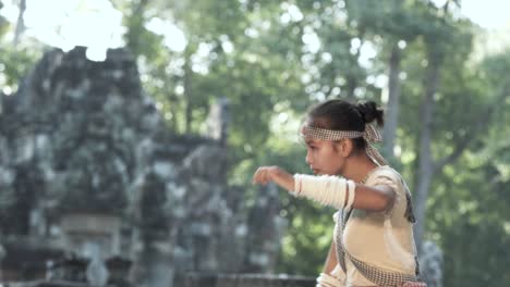 Bokator-an-ancient-martial-art,-slow-motion-of-girl-training-in-front-of-a-temple
