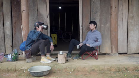 Two-vietnamese-friends-eating-in-silence-in-countryside