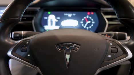A-look-at-the-interior-and-wheel-of-a-Tesla-car-at-the-American-company-car-Tesla-Motors-booth-during-the-International-Motor-Expo-showcasing-EV-electric-cars-in-Hong-Kong