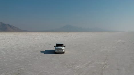 White-Pickup-Truck-Drives-Towards-Drone-on-Famous-Bonneville-Salt-Flats
