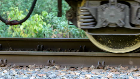 Passing-wheels-of-cargo-train,-railroad-transportation,-track-with-railway-car-or-wagon