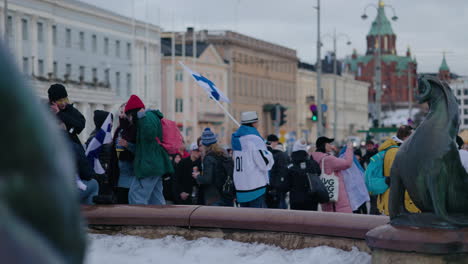 Crowd-celebrating-Olympic-Ice-hockey-gold-medal,-at-the-market-square,-in-Helsinki,-Finland---slow-motion
