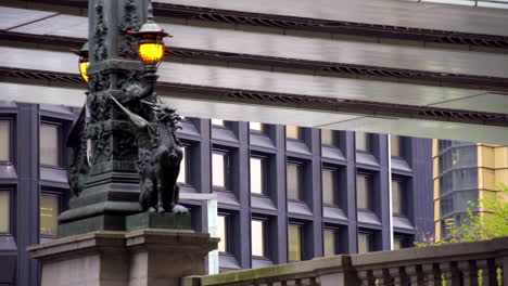 TOKYO,-JAPAN,-circa-April-2020:-pedestrians-walking-on-landmark-Nihonbashi-bridge-with-bronze-qilin-statues,-highway-overhead,-at-old-downtown-in-central-financial-area,-spring-day