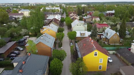 Drone-shot-over-Karlova-colorful-wooden-houses-in-summer-time