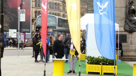 People-playing-virtual-reality-Pokemon-game-app-in-Manchester-city-experience