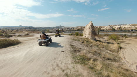 ATV-Tour-At-Cappadocia---People-Rides-At-Quad-Bike-Towards-Fairy-Chimneys-At-Goreme-In-Turkey