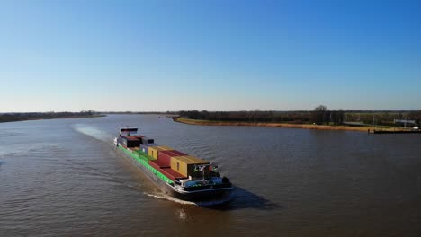 Aerial-View-Of-Approaching-Sendo-Liner-Inland-Freighter-Along-Der-Lek-In-Groot-Ammers