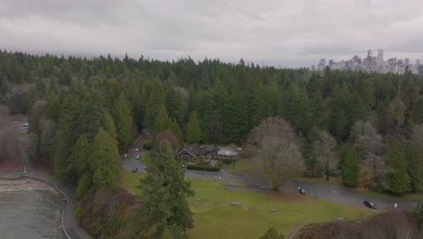Aerial-view-of-Stanley-park-with-tea-house-in-the-middle-of-the-forest,-British-Columbia,-Canda-in-4K
