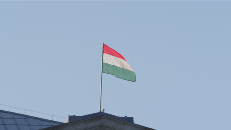 Hungarian-flag-flys-atop-historic-building-in-downtown-Budapest