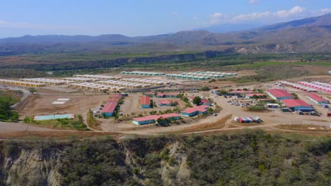 Aerial-View-of-Contractor-Workforce-On-Site-Facility-Temporary-Accommodation,-Offices,-Warehouses-Long-term-Project-of-Presa-Monte-Grande-Dam