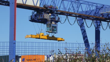 Shipping-container-crane-lift-machine-loading-heavy-cargo-shipyard-containers-for-export