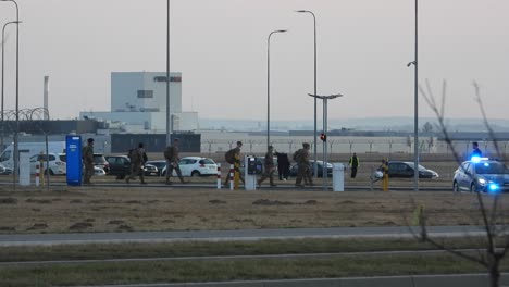 Polish-soldiers-walking-across-the-airport-during-the-president-of-the-USA-Joe-Biden's-arrival