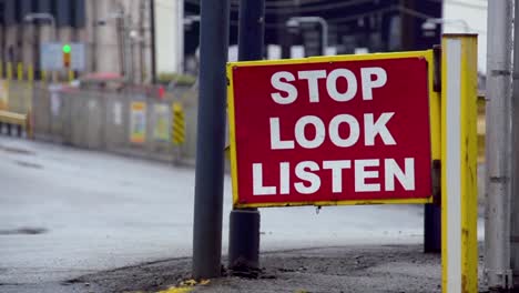 "Stop-look-listen"-pedestrian-street-sign-in-Braddock,-Pennsylvania