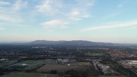 Smooth-aerial-approach-looking-toward-Mount-Dandenong-with-Eastlink-highway-and-other-facilities-in-the-foreground