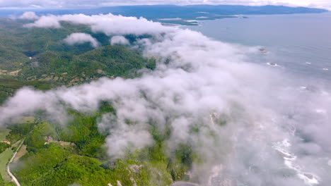 Drone-Flying-Over-Clouds-Revealing-Scenic-Chiloe-Island-Coastline