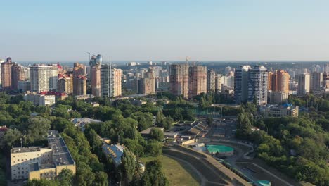 Aerial-drone-video-of-downtown-skyline-buildings-in-Kyiv-Ukraine-during-sunset