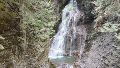 Margaret-Falls-flowing-down-a-steep,-rocky-cliff-in-the-lush-forest-of-Herald-Provincial-Park-in-British-Columbia,-Canada