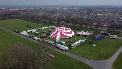 Planet-circus-daredevil-entertainment-colourful-swirl-tent-and-caravan-trailer-ring-aerial-view-wide-to-zoom-in