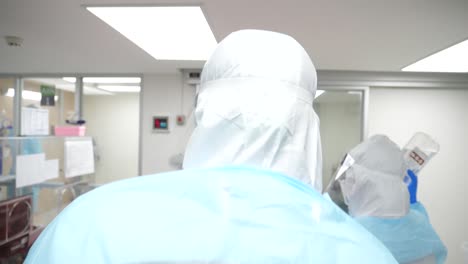 Medic-Staffs-Wearing-Fully-Protection-Suits-While-Taking-Care-Of-COVD-19-Patient