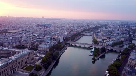 Flying-over-Seine-river-towards-Ile-de-la-Cite-at-sunrise